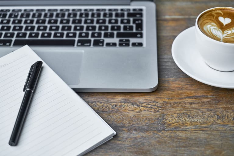 Spike Nx Cipro: a workspace with coffee and a laptop